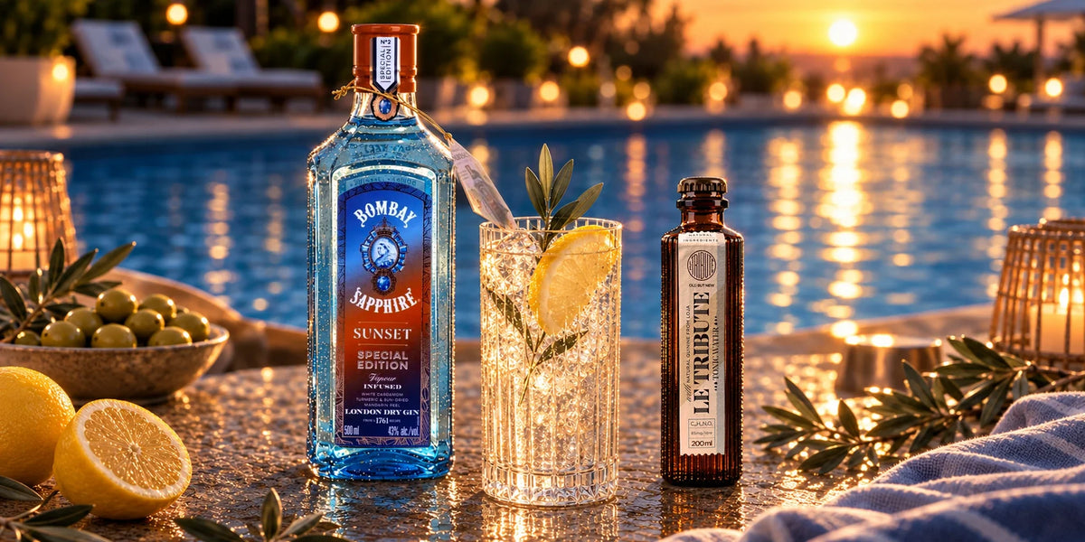 Bombay Sapphire Sunset Special Edition gin with Le Tribute tonic water and a citrus gin and tonic served beside a swimming pool at golden sunset.