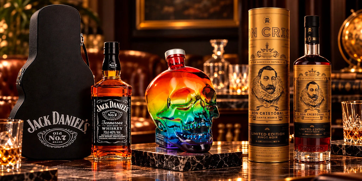 Collector spirits display featuring Jack Daniel’s Tennessee Whiskey Guitar Case Edition, Crystal Head Vodka Pride Rainbow Limited Edition and Ron Cristóbal Santa Maria Pinot Noir Limited Edition in an elegant luxury bar setting.