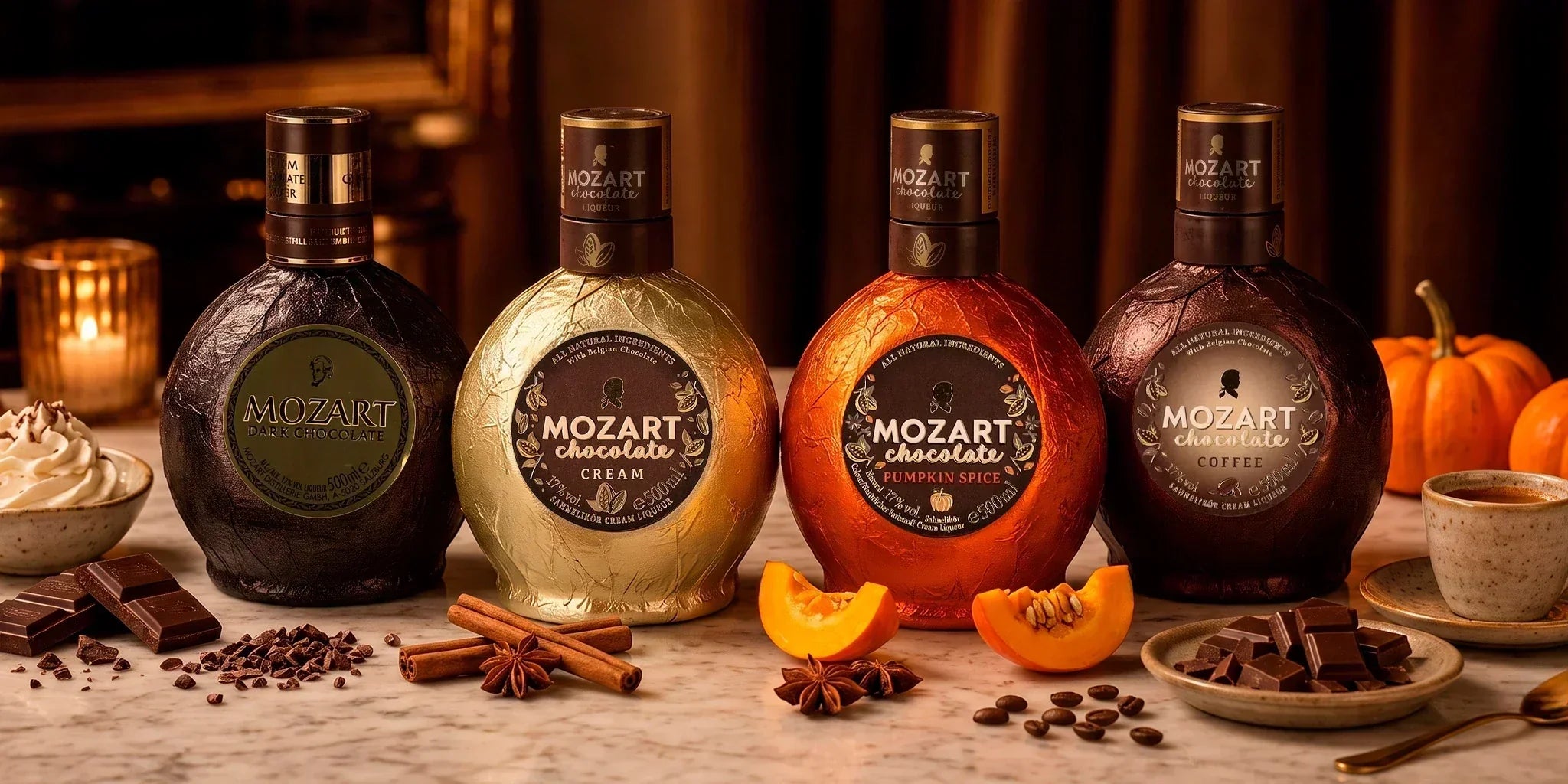Mozart chocolate liqueur selection with Dark Chocolate, Chocolate Cream, Pumpkin Spice and Coffee bottles styled with chocolate, coffee, cinnamon and pumpkin in warm dessert lighting.