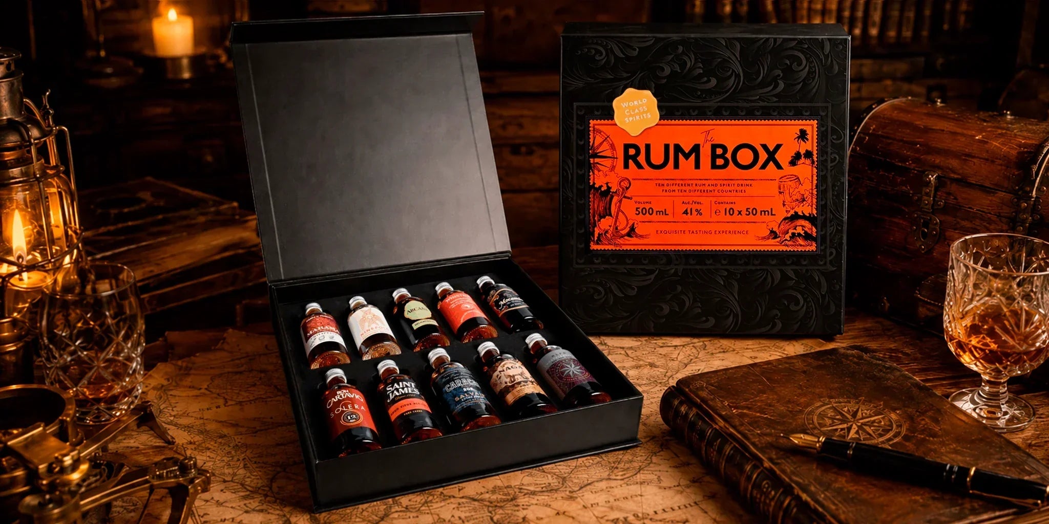 The Rum Box 41% Vol. rum tasting giftbox with ten miniature bottles, vintage maps, lantern, leather book, crystal glass and treasure chest in a dark premium explorer-style setting.